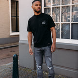 DISTRESSED FLARED JEANS