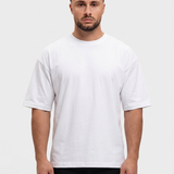 Oversized Cotton T-Shirt White — voorkant, Calvin (1,83 m) draagt maat S